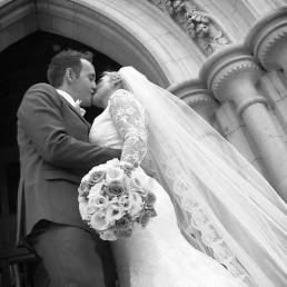 Video Still: Bride & groom kiss outside the church